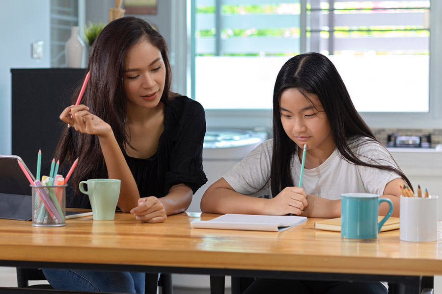 student and tutor together at a desk in Stanford